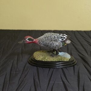Decorative Duck Figurine with Red and Gray Accents